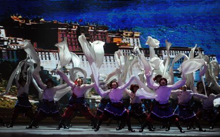 Dancers perform at the Great Hall of the People to celebrate the 60th anniversary of the founding of the People&apos;s Republic of China and the founding of Chinese Dancers Association in Beijing, Nov. 28, 2009. (Xinhua/Zhang Lei)