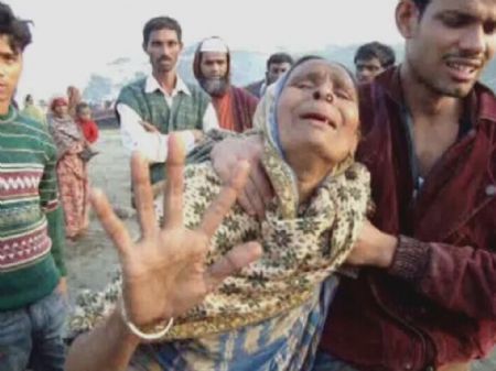 Locals react after a ferry, the M.V. Coco-4, overturned in the bank of the river Tetulia, near Lalmohon town in Bhola district November 28, 2009. 