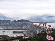 The Three Gorges Dam is a hydroelectric river dam that spans the Yangtze River in Sandouping, Yiling District,Yichang, Hubei, China. It is the world's largest electricity-generating plant of any kind. The dam site is 27 miles upstream from Yichang City proper, at Sandouping Town, 38km upstream from the Gezhouba Dam Lock, inside the third of the Three Gorges.  It has been a dream for generations.Now it has become a popular tourist site in China. [Photo by Jia Yunlong] 