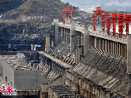 The Three Gorges Dam is a hydroelectric river dam that spans the Yangtze River in Sandouping, Yiling District,Yichang, Hubei, China. It is the world's largest electricity-generating plant of any kind. The dam site is 27 miles upstream from Yichang City proper, at Sandouping Town, 38km upstream from the Gezhouba Dam Lock, inside the third of the Three Gorges.  It has been a dream for generations.Now it has become a popular tourist site in China. [Photo by Jia Yunlong] 