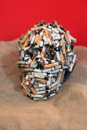 A skull composed by cigarette butts is demonstrated at the 4th Bejing Cultural and Creative Fair in Beijng, the capital city of China on Nov. 28, 2009. The fair, which was kicked off on Saturday, exhibited various strange and interesting cultural creations and attracted a great number of visitors.