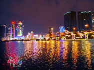 Macao lies on the western side of the Pearl River Delta, bordering Guangdong province in the north and facing the South China Sea in the east and south. The territory has thriving industries such as textiles, electronics and toys, and a notable tourist industry.This makes it one of the richest cities in the world. Macao at night presents a wonderful scene. You can enjoy night scene in different places.[Photo by Liu Guoxing]