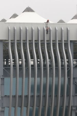 Workers proceed on the building site of China Ship Corporate Pavilion of the 2010 Shanghai World Expo in Shanghai, east China, Nov. 29, 2009. Most of the pavilions are taking on a dashing look with the coming of the 2010 Shanghai World Expo, which will fall in May of next year. 