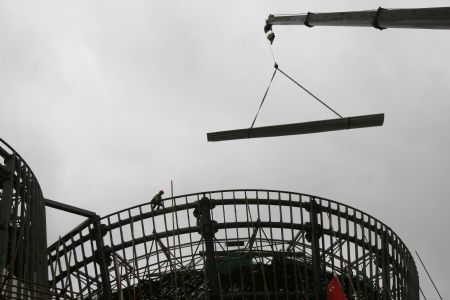 Workers proceed on a building site of the 2010 Shanghai World Expo in Shanghai, east China, Nov. 29, 2009. Most of the pavilions are taking on a dashing look with the coming of the 2010 Shanghai World Expo, which will fall in May of next year. 