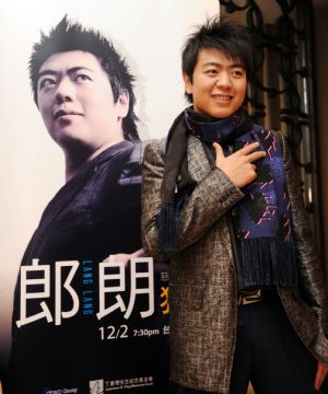 Lang Lang poses for photos at the press conference in Taipei, southeast China's Taiwan Province, Nov. 30, 2009. Lang Lang Charity Concert will be held at Taipei Arena on Dec. 2, and all the tickets sales will be donated for the rebuilding construction damaged by Typhoon Morakot in August.