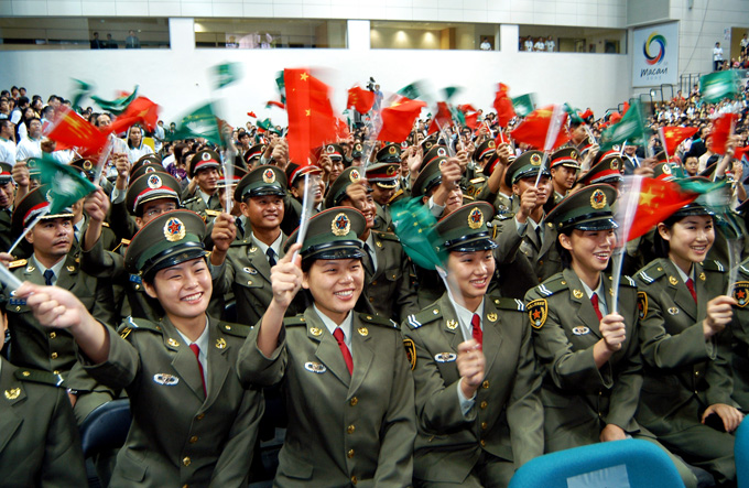 Members of the PLA garrison in Macao welcome Chinese Olympic gold medalists. They visited Macao on Sept. 9, 2004.