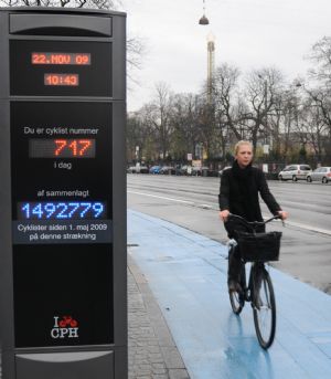 A woman rides her bicycle on a bicycle path in Copenhagen, capital of Denmark, on Nov. 23, 2009. Copenhagen is known as one of the most bicycle-friendly cities in the world. 36% of all citizens commute to work or school by bicycle. Also, the city&apos;s bicycle paths are extensive and well used. The local government has also taken some measures to promote the energy-efficient, economical and enjoyable means of transportation. (Xinhua/Zhao Changchun)