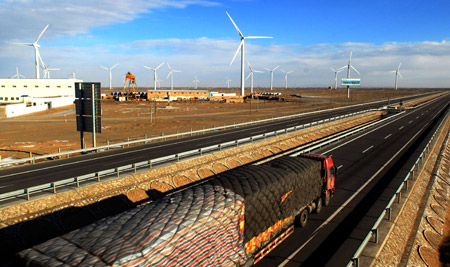Photo taken on Nov. 30, 2009 shows the Jiuquan wind power base in northwest China's Gansu Province. (Xinhua/Zhu Shiliang)