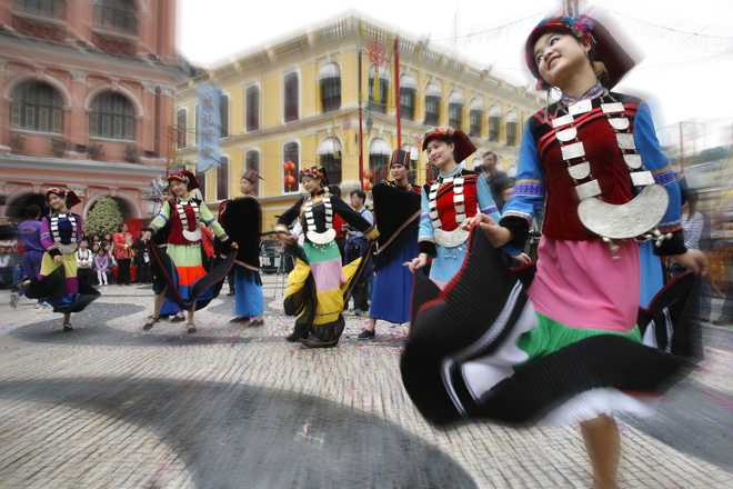 People dance during the Lusophone Festival in Macao.