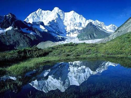 Mt. Qomolangma is the highest mountain in the world with a height of 8,848.13 meters above sea level. It looks like a huge pyramid reaching into the sky. 