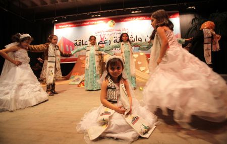 Palestinian children with disabilities perform at a theater to mark the International Day of Disabled People in Gaza city on Dec. 3, 2009.