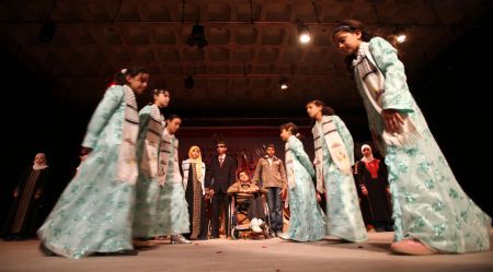 Palestinian children with disabilities perform at a theater to mark the International Day of Disabled People in Gaza city on Dec. 3, 2009. 