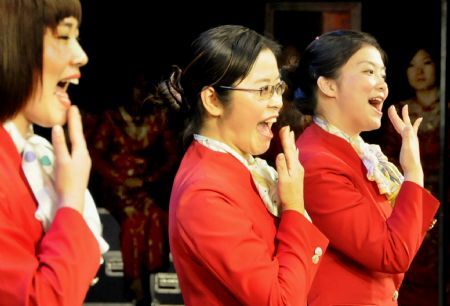 Contestants take part in sign language contest in Shanghai, east China, Dec. 3, 2009. A total of 48 staff members from hotels and bankers took part in a sign language contest here Thursday, to mark the 18th International Day of Disabled Persons, which falls on Dec. 3.(Xinhua/Zhang Jinqiao)