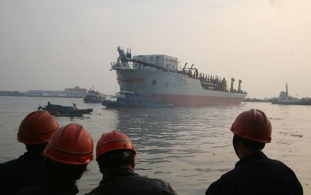 Chang Jing 6, one of the country's largest Trailing Suction Hopper Dredger, is launched in Nantong, east China's Jiangsu Province, Dec. 3, 2009.(Xinhua/Wang Junrong)