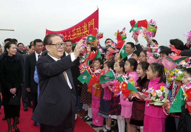 President Jiang Zemin waves to those welcoming him at the airport. This particular visit to Macao took place on Dec. 19, 2000.