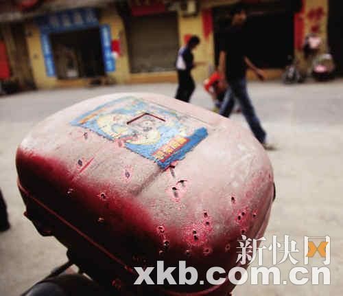 After the accident, the motorcycle rear box was full of bullet holes.