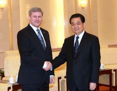 Chinese President Hu Jintao (R) meets with Canadian Prime Minister Stephen Harper in Beijing, capital of China, Dec. 3, 2009. [Pang Xinglei/Xinhua] 