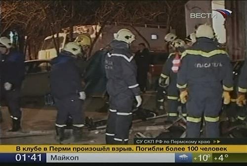 Servicemen clean the scene after an firework explosion claimed 111 lives in Perm, Russian Urals region.