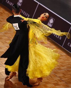 Nam Sangwung and Song Yina(R) of South Korea compete in Slow Foxtrot of Standard competition in Dancesport at the 2009 East Asian Games in Hong Kong on Dec. 6, 2009. [Zhang Chen/Xinhua]