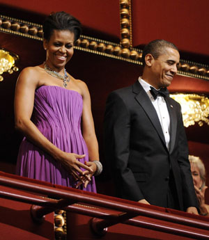 U.S. President Barack Obama and first lady Michelle Obama arrive for the national anthem for the Kennedy Center Honorees at the Kennedy Center in Washington, December 6, 2009.[Xinhua/Reuters]