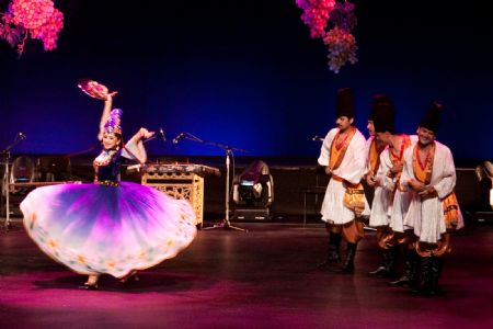 China&apos;s Xinjiang troupe performers pose during a singing and dancing performance in Brisbane, Australia, on Dec. 7, 2009. Brisbane serves as the second stop of China&apos;s Xinjiang foreign cultural exchange delegation during its visit in Australia. [Chen Mingwei/Xinhua]