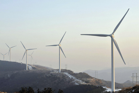 Wind mills are seen at the Tazigou wind power station in Fuxin, Liaoning province November 22, 2009. According to China Windpower Group Ltd., Fuxin is an ideal region for wind power development, as it possesses fine wind resources as well as satisfactory on-grid conditions, Xinhua News Agency reported.