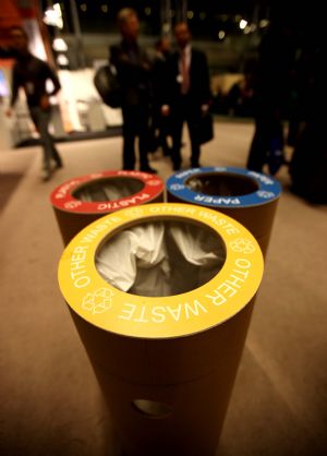 Degradable paper wastebins are installed in the Bella Center, venue of the 15th United Nations Climate Change Conference (COP15), in Copenhagen, capital of Denmark, Dec. 7, 2009. [Xie Xiudong/Xinhua]