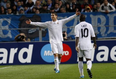 Real Madrid&apos;s Cristiano Ronaldo celebrates after his goal against Olympique Marseille during their Champions League soccer match at the Velodrome Stadium in Marseille December 8, 2009. [Xinhua/Reuters]