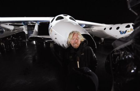 Billionaire Richard Branson is interviewed after unveiling Virgin Galactic&apos;s SpaceShipTwo in Mojave, California December 7, 2009.[Xinhua/Reuters] 