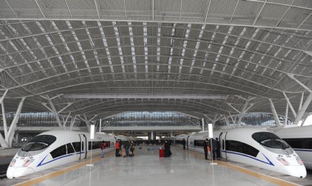 The test-running trains prepares for their first journey at the station in Guangzhou, capital of south China&apos;s Guangdong Province, Dec. 9, 2009. [Lu Hanxin/Xinhua]