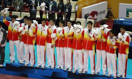 Players of China celebrate during the awarding ceremony for the men&apos;s volleyball at the 2009 East Asian Games in Hong Kong, south China, on Dec. 9, 2009. China won the gold after beating Japan 3-2 in the final on Dec. 9.[Duan Zhuoli/Xinhua] 