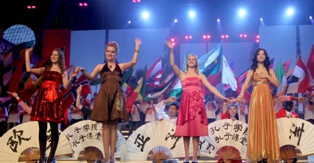 Students of the overseas Confucius Institutes perform during a performing art show in Beijing, China, Dec. 11, 2009. On Friday evening, students of the Confucius Institutes from 22 countries staged a performing art show, featuring Chinese songs and dances, as well as Peking Opera. [Chen Jianli/Xinhua]