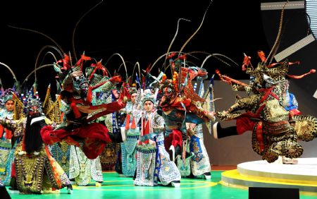 Performers from Tianjin perform on the stage during the closing ceremony of the 2009 East Asian Games in Hong Kong, south China, Dec. 13, 2009. The sixth East Asian Games will be held in Tianjin in 2013. [Song Zhenping/Xinhua]