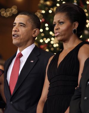 U.S. President Barack Obama and first lady Michelle Obama attend the Christmas in Washington Celebration at the National Building Museum in Washington December 13, 2009.[Xinhua/Reuters]