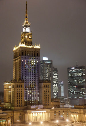 The logo and the slogan of the 2012 European soccer championship are projected onto the Palace of Culture in Warsaw December 14, 2009. [Xinhua/Reuters]