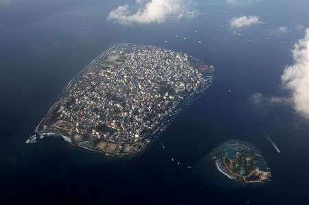 An areal view shows the Maldives capital Male December 14, 2009. Maldives has a population of some 400,000 islanders, whose livelihood from fishing and tourism is being hit by climate change. 
