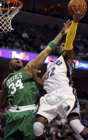 Memphis Grizzlies guard O.J. Mayo (R) shoots under pressure by Boston Celtics forward Paul Pierce during the second half of NBA basketball action in Memphis, Tennessee December 14, 2009.