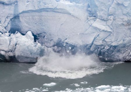 Pieces of ice fall from the front of Argentina&apos;s Perito Moreno glacier near the city of El Calafate, in the Patagonian province of Santa Cruz, December 14, 2009.