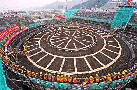 The photo taken on Dec. 14, 2009 shows workers prepare at the construction site of the second of the two generating units of the Sanmen nuclear power plant in east China&apos;s Zhejiang Province. As the second of the two generating units of the Sanmen nuclear power plant was put into construction on Tuesday, China started the full scale construction of its first third-generation pressurized water reactors using AP 1000 technologies. The first phase project will include two units each with a generating capacity of 1.25 million kw. (Xinhua/Tan Jin)