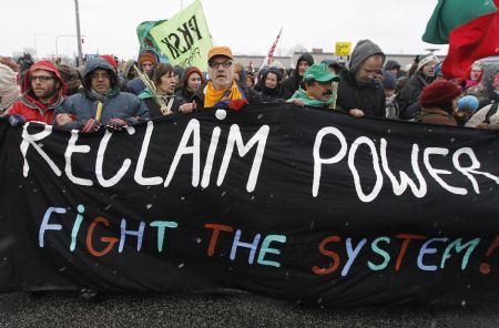 Protestors march towards the Bella Center, where the UN Climate Change 2009 Conference is taking place, during a demonstration in Copenhagen December 16, 2009. [Xinhua/Reuters]