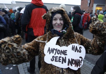 A protestor takes part in a demonstration in Copenhagen December 16, 2009. Copenhagen is the host city for the United Nations Climate Change Conference 2009, which lasts from December 7 until December 18.(