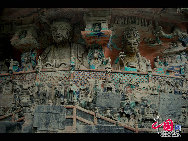 The Dazu Rock Carvings are a series of Chinese religious sculptures and carvings, dating back as far as the 7th century A.D., depicting and influenced by Buddhist, Confucian and Taoist beliefs. Listed as a World Heritage Site, the Dazu Rock Carvings are made up of 75 protected sites containing some 50,000 statues, with over 100,000 Chinese characters forming inscriptions and epigraphs. The sites are located in Chongqing Municipality within the steep hillsides throughout Dazu County. [Photo by Wu Changqing] 