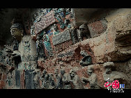 The Dazu Rock Carvings are a series of Chinese religious sculptures and carvings, dating back as far as the 7th century A.D., depicting and influenced by Buddhist, Confucian and Taoist beliefs. Listed as a World Heritage Site, the Dazu Rock Carvings are made up of 75 protected sites containing some 50,000 statues, with over 100,000 Chinese characters forming inscriptions and epigraphs. The sites are located in Chongqing Municipality within the steep hillsides throughout Dazu County. [Photo by Wu Changqing] 