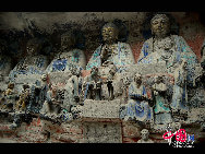 The Dazu Rock Carvings are a series of Chinese religious sculptures and carvings, dating back as far as the 7th century A.D., depicting and influenced by Buddhist, Confucian and Taoist beliefs. Listed as a World Heritage Site, the Dazu Rock Carvings are made up of 75 protected sites containing some 50,000 statues, with over 100,000 Chinese characters forming inscriptions and epigraphs. The sites are located in Chongqing Municipality within the steep hillsides throughout Dazu County. [Photo by Wu Changqing] 