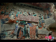 The Dazu Rock Carvings are a series of Chinese religious sculptures and carvings, dating back as far as the 7th century A.D., depicting and influenced by Buddhist, Confucian and Taoist beliefs. Listed as a World Heritage Site, the Dazu Rock Carvings are made up of 75 protected sites containing some 50,000 statues, with over 100,000 Chinese characters forming inscriptions and epigraphs. The sites are located in Chongqing Municipality within the steep hillsides throughout Dazu County. [Photo by Wu Changqing] 