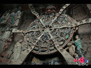The Dazu Rock Carvings are a series of Chinese religious sculptures and carvings, dating back as far as the 7th century A.D., depicting and influenced by Buddhist, Confucian and Taoist beliefs. Listed as a World Heritage Site, the Dazu Rock Carvings are made up of 75 protected sites containing some 50,000 statues, with over 100,000 Chinese characters forming inscriptions and epigraphs. The sites are located in Chongqing Municipality within the steep hillsides throughout Dazu County. [Photo by Wu Changqing] 