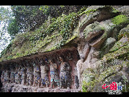 The Dazu Rock Carvings are a series of Chinese religious sculptures and carvings, dating back as far as the 7th century A.D., depicting and influenced by Buddhist, Confucian and Taoist beliefs. Listed as a World Heritage Site, the Dazu Rock Carvings are made up of 75 protected sites containing some 50,000 statues, with over 100,000 Chinese characters forming inscriptions and epigraphs. The sites are located in Chongqing Municipality within the steep hillsides throughout Dazu County. [Photo by Wu Changqing] 