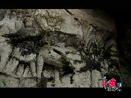 The Dazu Rock Carvings are a series of Chinese religious sculptures and carvings, dating back as far as the 7th century A.D., depicting and influenced by Buddhist, Confucian and Taoist beliefs. Listed as a World Heritage Site, the Dazu Rock Carvings are made up of 75 protected sites containing some 50,000 statues, with over 100,000 Chinese characters forming inscriptions and epigraphs. The sites are located in Chongqing Municipality within the steep hillsides throughout Dazu County. [Photo by Wu Changqing] 
