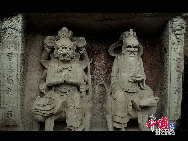 The Dazu Rock Carvings are a series of Chinese religious sculptures and carvings, dating back as far as the 7th century A.D., depicting and influenced by Buddhist, Confucian and Taoist beliefs. Listed as a World Heritage Site, the Dazu Rock Carvings are made up of 75 protected sites containing some 50,000 statues, with over 100,000 Chinese characters forming inscriptions and epigraphs. The sites are located in Chongqing Municipality within the steep hillsides throughout Dazu County. [Photo by Wu Changqing] 