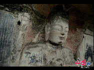 The Dazu Rock Carvings are a series of Chinese religious sculptures and carvings, dating back as far as the 7th century A.D., depicting and influenced by Buddhist, Confucian and Taoist beliefs. Listed as a World Heritage Site, the Dazu Rock Carvings are made up of 75 protected sites containing some 50,000 statues, with over 100,000 Chinese characters forming inscriptions and epigraphs. The sites are located in Chongqing Municipality within the steep hillsides throughout Dazu County. [Photo by Wu Changqing] 